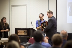 Mischa receives the "Past President's Plaque" from incoming PPGBA president, Alexis