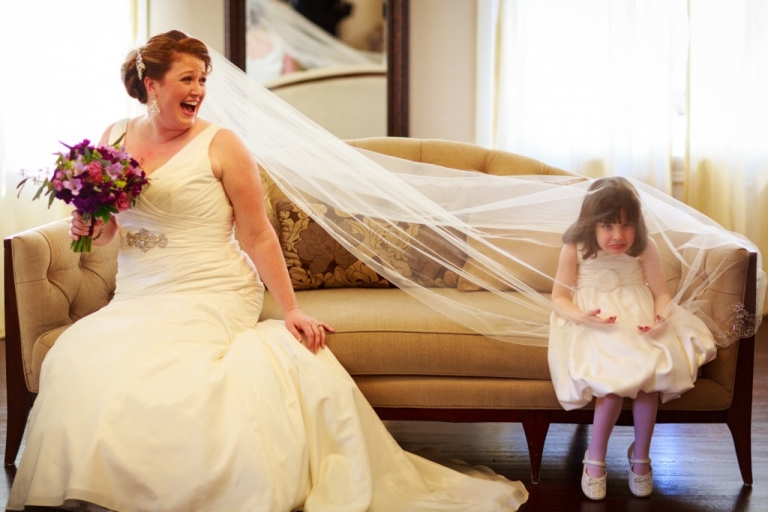 funny bride and flower girl pose