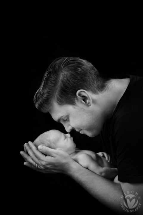 daddy with newborn studio portrait