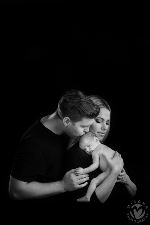 family with newborn studio portrait