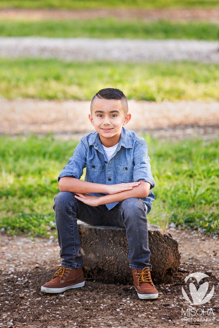 outdoor seated boy portrait